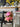 Small dog in pink cap with name "Tiffany", sitting on a chair